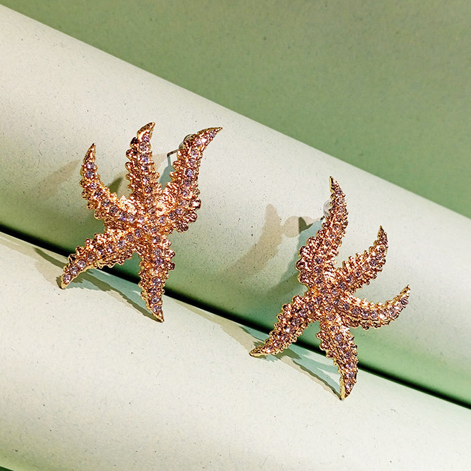 BOUCLES D'OREILLES ANEMONE EN BRONZE DORÉ A FORME D'ETOILE DE MER