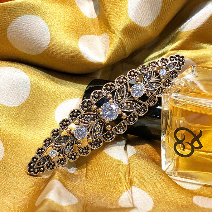 BROCHE KANDYS EN BRONZE A FORME OVALE