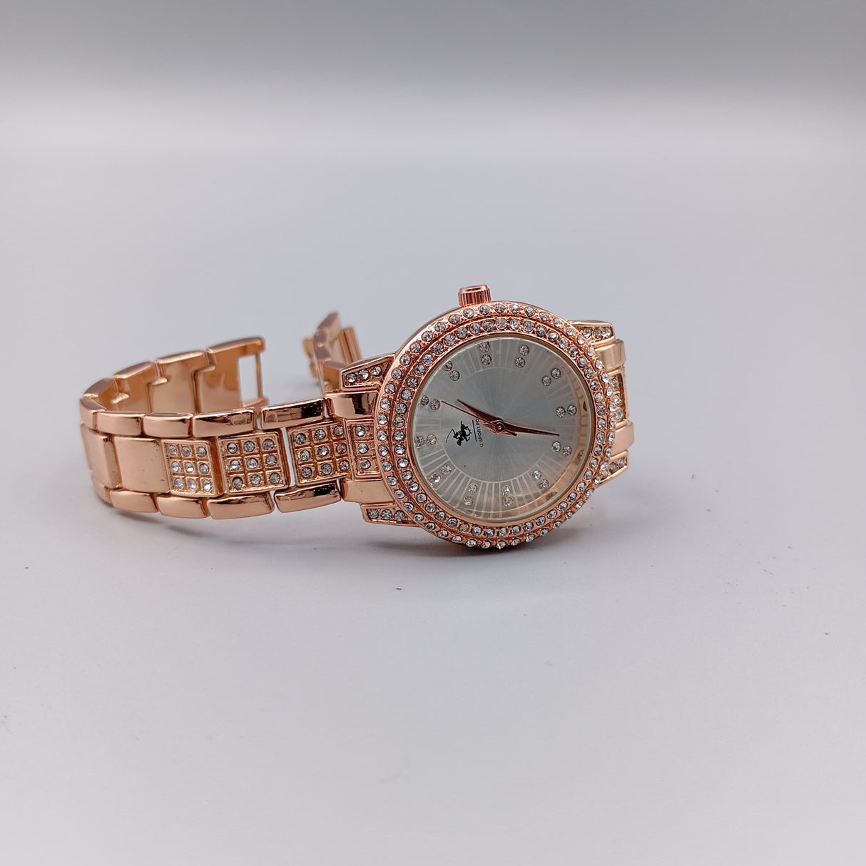 MONTRE POLO P0050 CUIVRE AUX STRASS. CAD DORE, INT ARGENTE.